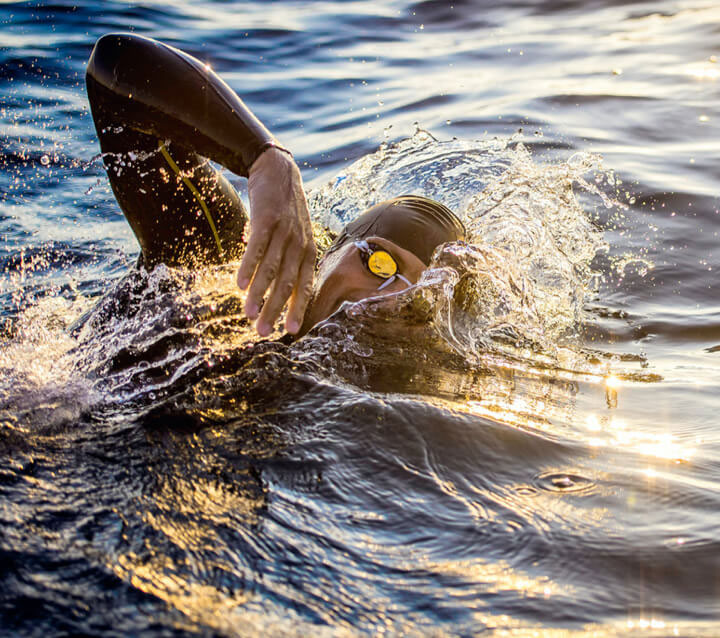 Swimmer training for a race in open water