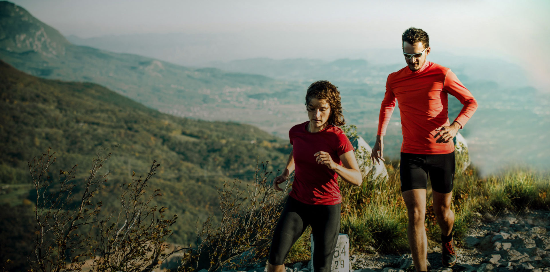 Man and woman training on running trails